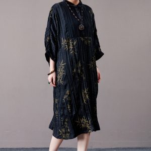 Elegant Black Pleated Maxi Dress with Golden Bamboo Motif