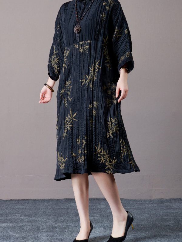Elegant Black Pleated Maxi Dress with Golden Bamboo Motif - Image 3