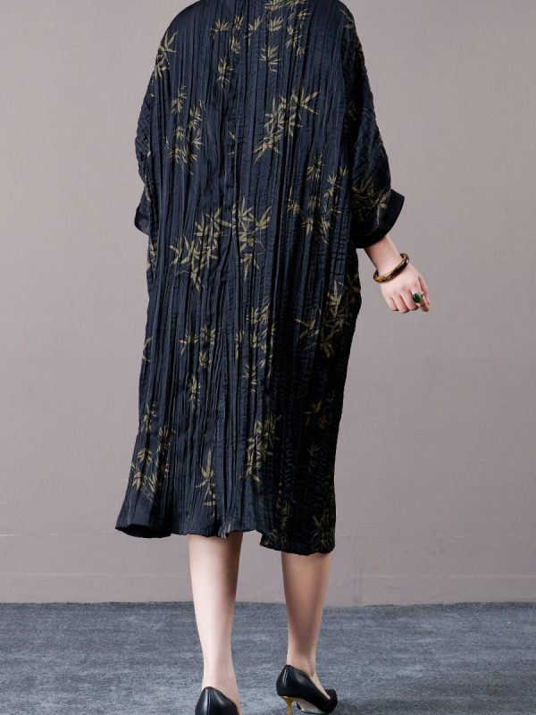 Elegant Black Pleated Maxi Dress with Golden Bamboo Motif - Image 4